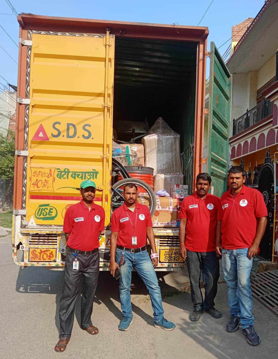 aastha packers and movers team loading household items on truck